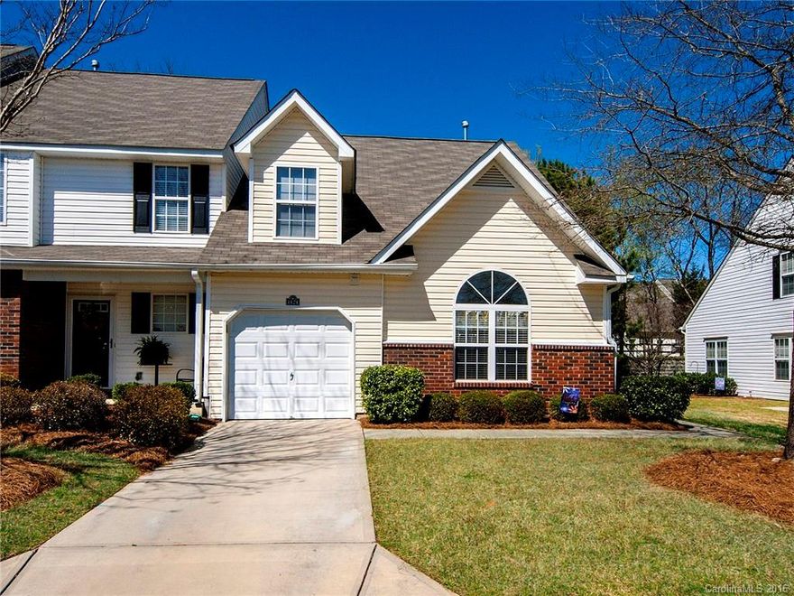 This home shows like a model! End unit with tons of natural light and one car garage. Conveniently located off the first Rock Hill exit on I-77.  The open floor plan features dark, wide-plank flooring throughout the main living areas. On-trend, gourmet white kitchen with granite counter tops, stainless steel appliances and deep stainless sink. The first floor master suite looks like a page out of a magazine with the wood plank accent wall and vaulted ceiling. Secondary bedrooms are upstairs.