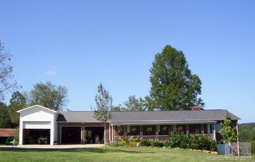 Great low maintenance brick and vinyl family home on almost 7 acres features 1900+ heated square feet on main level. 3 Bedroom 2 baths on main with large family room open to dining.  Large sunroom off dining area opens to back deck with distant mountain views. Central vac.   3 bay garage large enough to accommodate 5th wheel camper or motor home. Full unfinished basement includes wood stove, 4th garage bay and rough 3rd full bath.  120'x 50' barn with 110v power for animals and feed storage. 182' of frontage on silver creek across from golf course.  Includes Record# 43374 PIN# 1771155683