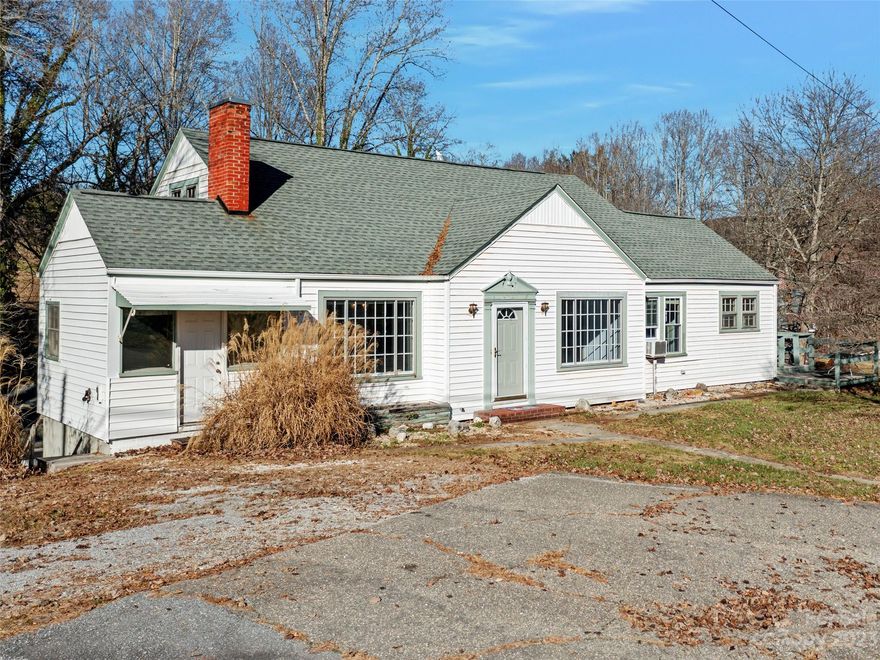 Convenient & affordable home, 2 homes for the price of 1. Main Level Living room with a large paned window, brick fireplace, built-in shelving & hardwood floors beneath carpet; spacious kitchen, lots of built-ins, dining area & accessible to formal dining room. 3 bedrooms on the main level plus an office. Large bonus room upstairs (potential for add'l living space). The apartment on the basement level has a separate entrance - use for extra income or guest quarters. Includes a living room, BR, full bath, kitchen & dining area, workshop & storage. 2 car garage has room for cars plus lawn equipment. Large back yard for 2 and 4 legged friends.