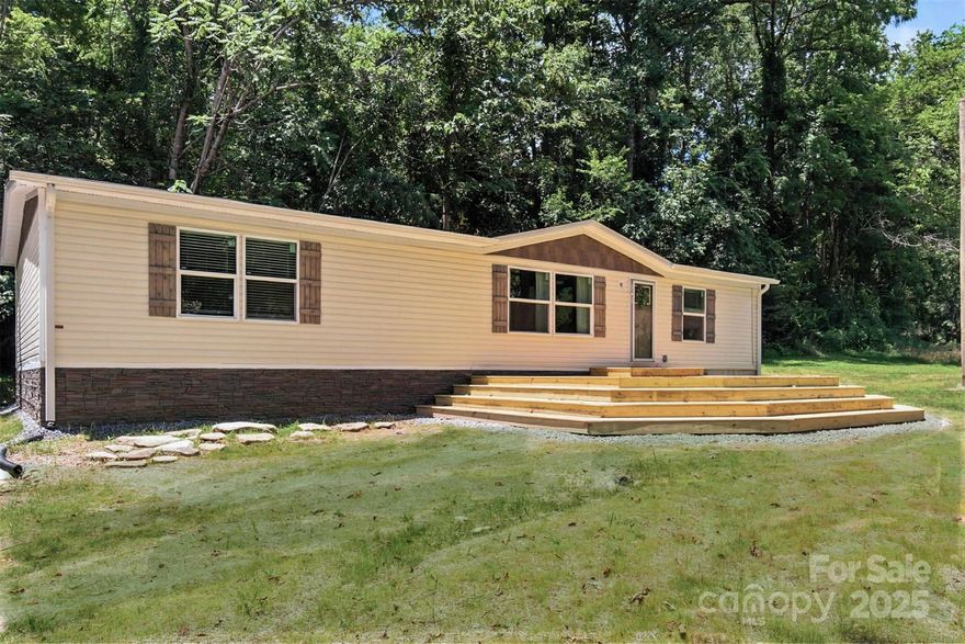 Privacy abounds in this new construction retreat sitting on 2.75 acres in beautiful Apple Country. A crystal
clear creek runs the length of the property. Just 15 minutes from downtown Hendersonville, this three
bedroom, two bath single level home has just under 1500 ft.² of living space. with a large 16x20 front deck
with wrap around steps and back porch
The property features plenty of room to build an additional dwelling unit (ADU), store your RV or build a
garage / storage building. (Buyer to verify use is permitted).
Not located in a flood zone, no HOA and no neighbors within view.