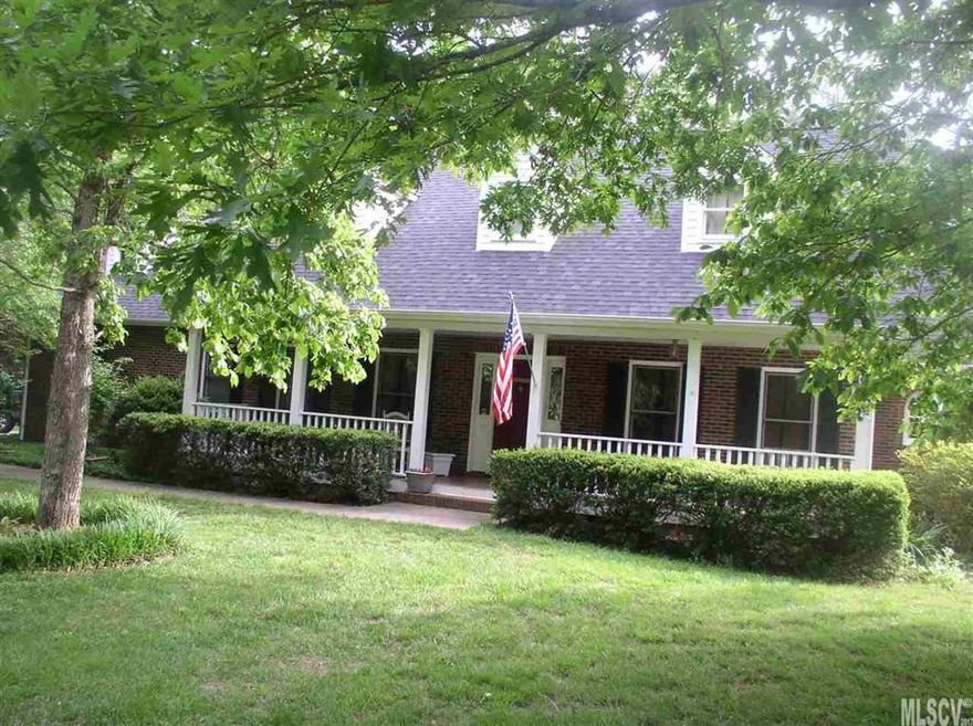 Come sit on the rocking chair front porch of this wonderful brick home in desirable Deerfield situated on an acre of land. Updated kitchen with granite counter tops and stainless appliances. New hardwood floors throughout main level except den area. Laundry on main, butlers pantry between kitchen and formal dining room. Awesome screened porch on rear of house plus large deck for summer cookouts. Master has huge walkin closet.  The storage in this home is amazing.  Ceiling fans in almost every room .  There are two in the bonus room.  Garage is 624 sq ft so plenty of room for the handy man.  There is also an outbuilding and a very large garden spot.