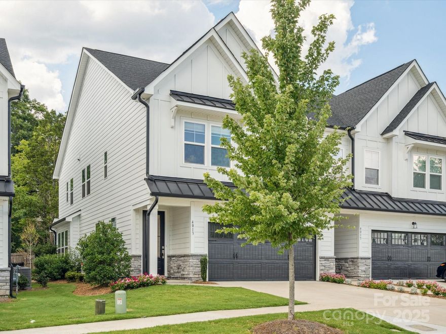 If you love the idea of new construction but don’t want the wait, dust, or builder surprises, this Emery townhome is the sweet spot. Located in a quiet, established duet-style community off Rea Rd between Providence and Colony, this 3-year-old former model already has the upgrades, polish, and livability that brand-new homes are still working toward. Home is quality constructed by JP Orleans.

The main level is open and filled with natural light, anchored by 5-inch engineered hardwoods and a white gourmet kitchen that feels both timeless and elevated. Quartz counters, a large island, upgraded cabinetry, an apron-front cast iron sink, stainless appliances, and a 36" gas cooktop make this space ideal for everyday living and entertaining—no “builder basic” finishes here.

What really sets this home apart from new construction? The extras are already done. Designer lighting, custom Hunter Douglas energy-efficient cellular shades upstairs, solar shades downstairs, fresh paint, and professionally designed landscaping with a spigot-fed drip irrigation system—these are the upgrades buyers usually add later (at extra cost and hassle). Here, it’s already handled.

Upstairs, you’ll find three bedrooms plus a loft, including a primary suite with two walk-in closets and a dual-vanity bath. Step outside to a screened porch and flat backyard—perfect for pets, play, or just unwinding after a long day.

The HOA takes care of lawn maintenance, and the neighborhood includes a small dog park, adding to the easy, low-maintenance lifestyle.

Bottom line: this home gives you the look and feel buyers want from new construction—without the delays, added costs, or guesswork. It’s truly move-in ready and thoughtfully finished from top to bottom.