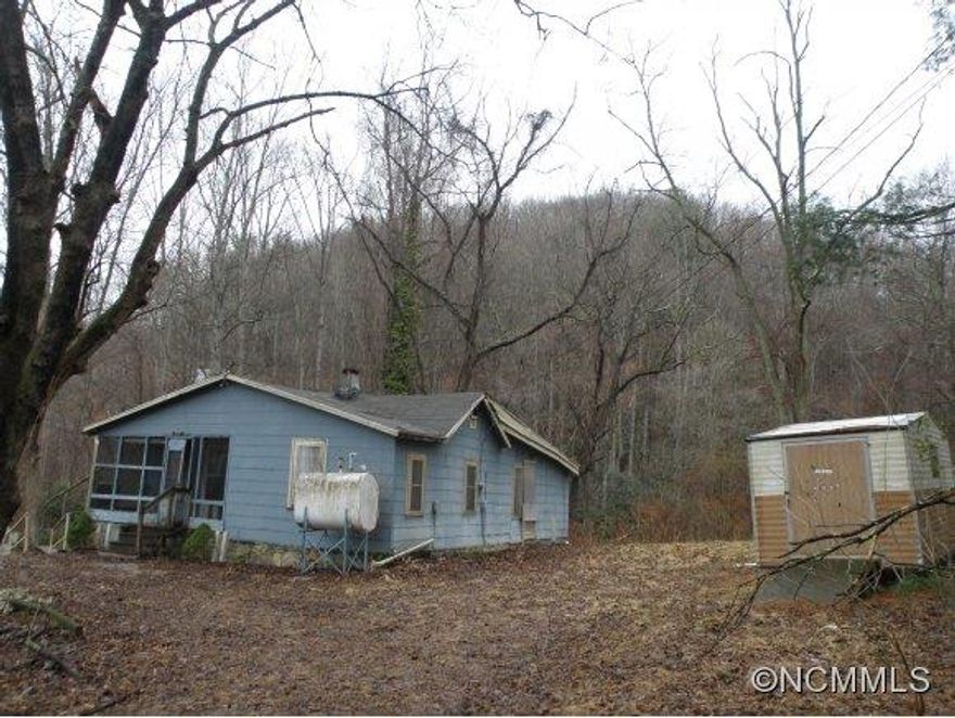 Handyman Special, gorgeous land, level 1.22 acres, house needs a lot of TLC, property being sold "as-is", well & septic, wonderful creek in back, small covered front porch, great Swannanoa location, NO permanent heat, private, quiet dead-end street. Additional PIN#.