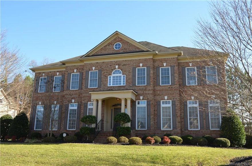 John Wieland custom 2.5 story dream home with upgrades in desirable Bridgemill Subdivision, Indian Land, SC! 5 BR, 5 BA w/stunning new paint, new carpet, extensive moldings, tray ceilings, built-ins, hardwoods on Main! Chefs gourmet Kitchen, gorgeous white cabinets, granite c/tops w/wall ovens! 2-story Great Room w/gas log FP. Large Master Suite on 2nd Level w/3 secondary bedrooms, Computer Niche! 3rd Level 824 SF Room, full bathroom. Walk-in Attic Storage! 3 car garage w/epoxy flooring! Deck!