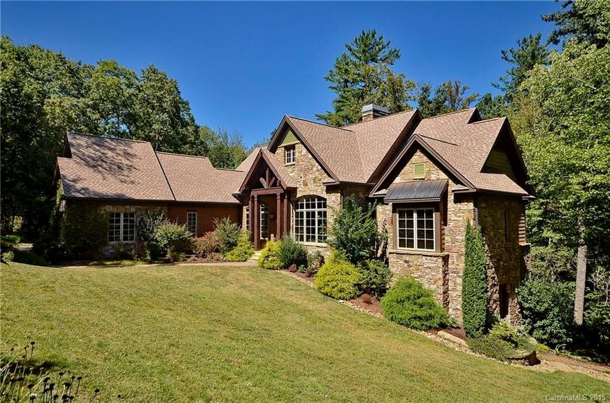 This gorgeous home sits on the waters of Powder Creek here at The Cliffs of Walnut Cove. Two outdoor fireplaces, and plenty of deck/terrace space to enjoy the outdoors. Open floor plan, with a gourmet kitchen great for entertaining. Hardwood floors throughout main. Large master suite with his/hers closets. Two interior fireplaces, and very accommodating guest rooms.  A must see if you are looking for a private, mountain home here at Walnut Cove!