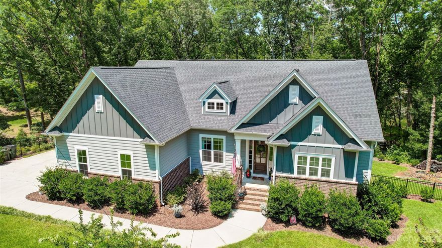 LIVE THE DREAM on Lake Wylie in this waterfront beauty in sought after Heron Cove.  This amazing home boasts beautiful finishes & details throughout along w/ an open floor plan, great for entertaining. You’ll love the bright & airy main floor featuring executive office(could be 4th bedroom), spacious laundry room, lake facing great room, kitchen & dining room. Engage your inner chef in the gourmet kitchen, complete w/ SS appliances, commercial gas range, large island w/ seating, & walk-in pantry.  Lovely primary retreat features vaulted ceiling, custom closet w/ dressing area & spa like bath. Lower level boasts huge rec room, 2 additional BRs, full bath, & massive unfinished basement area with space to expand. The composite deck, paver patio, fabulous swim spa w/ hot tub, & covered dock are perfect for enjoying the outdoors.  Located on a serene cove, ideal for boating & watersports.  Heron Cove offers community pool.  Clover schools, SC taxes, convenient to restaurants & shopping.