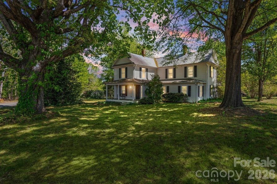 Step back to a quieter time at this nostalgic country manor, peacefully set on 2 acres with postcard worthy views of Pilot Mountain. From the wide covered front porch, you can sip your morning coffee, listen to the birds, and watch the countryside wake up around you—just the way life used to feel. Built in the early 1900s, this home carries the character and craftsmanship of its era, thoughtfully preserved through the years while welcoming a collection of meaningful updates. Inside, you’ll find the kind of warmth and simplicity that invites you to slow down, stay awhile, and make memories. With no restrictions and plenty of open space, the property is ideal for outdoor activities, gardening, gatherings, and all the moments you want to share with family and friends. Whether you’re dreaming of a small homestead, a peaceful retreat, or a place to reconnect with nature, this timeless East Bend setting offers room to breathe and room to grow. Property being sold ‘As is”.