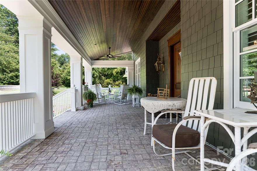 This is the gathering place for neighborhood meets and greets, an exceptional Arts & Crafts home in Biltmore Forest, set on over an acre and completely reimagined within the last five years by Robert Griffin Architects. Thoughtfully renovated throughout, the home features rebuilt fireplaces, Hardie fiber cement shake siding, all new windows and exterior doors, a three-zone HVAC system, and an impressive 43-by-12-foot covered front porch. Inside, the open-concept layout strikes a balance between connection and definition, with a separate dining room and private study. The main level is designed for everyday ease, offering a chef’s kitchen and a serene primary suite. Upstairs, four generously sized bedrooms and three full baths provide ample space for family and guests. The lower level is ideal for entertaining or unwinding, complete with an additional bedroom, recreation room, den, sauna, fireplace and abundant storage. Outdoors, the expansive yard offers level space for play, a fire pit and room for a future pool. Still, the highlight may be the three oversized covered porches, ideally designed for year-round gathering and enjoyment. This inviting home was made to host and enjoy with ease, and it’s exceptionally easy to show.