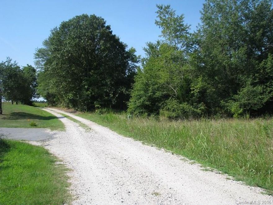 Nice lot convenient to I-77 on Gravel Rd.  Level wooded lot with electric utility on lot.