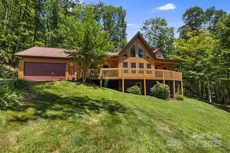 This beautifully maintained, one-owner cabin was built with exceptional attention to detail and no expense spared. Constructed with 2x6 framing, Anderson windows, and high-quality finishes throughout, the home features vaulted ceilings, hardwood floors, granite countertops, and stainless steel appliances. While listed as a 2-bedroom home, it also includes a bonus room offering flexible space for guests, an office, or hobbies. Enjoy comfortable one-level living with a striking stone fireplace, an oversized primary bathroom featuring a jetted tub, an attached main-level garage, plus an additional garage/workshop on the lower level for added functionality. Outdoor living is a highlight, with a wrap-around deck and a spacious covered rear porch, perfect for relaxing or entertaining. All of this is set on an oversized lot with a stocked creek-fed pond, with a dock, just minutes from downtown Burnsville. A rare combination of craftsmanship, space, and setting.