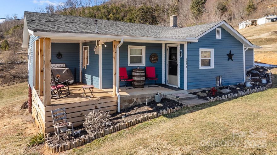 Welcome to 1293 Chambers Mountain Rd. Nestled on just under half an acre of unrestricted land, this fully renovated 1920s gem offers a perfect blend of historic charm and modern comfort. Featuring 3 spacious bedrooms and 1 stylishly updated bathroom, this home boasts breathtaking long-range mountain views that will captivate you year-round. The renovations include thoughtful updates throughout, preserving its character while adding a cabin feel. Conveniently located just minutes from the heart of Waynesville, you’ll enjoy easy access to shopping, dining, and outdoor adventures. With its prime location and unrestricted land, this property offers endless potential—whether you're dreaming of a serene mountain retreat, a hobby farm, or a creative outdoor space. Don’t miss this rare opportunity!