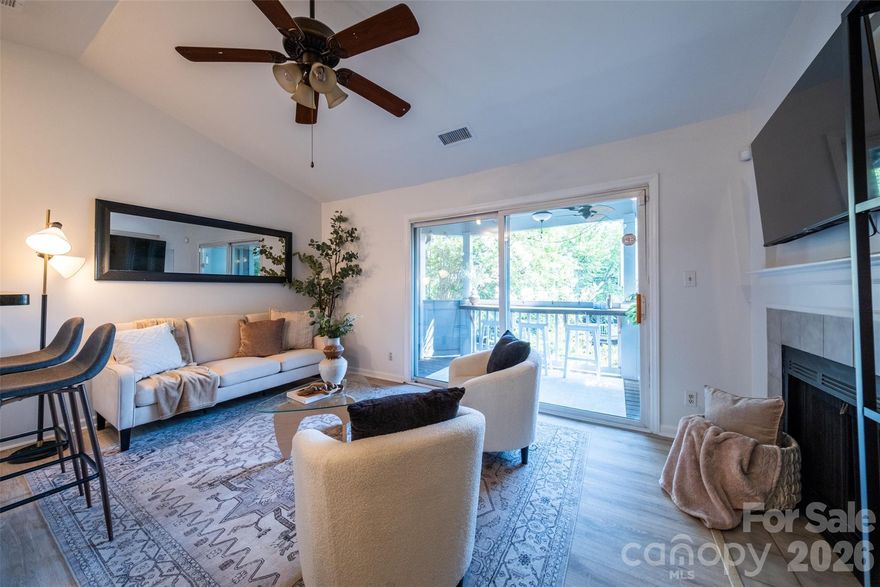 Freshly painted crisp white! This bright and airy top floor home in popular Fourth Ward Square feels like a treehouse.  Adorable balcony overlooks tree line and pool. Close to everything Uptown has to offer. Enjoy Panther, Knights, Hornets and soccer games, concerts, restaurants, bars, parks and light rail. Updated with stainless steel appliances, granite countertops, LVP flooring, tiled bath, vaulted ceiling, wired for Google fiber and large covered balcony with a storage room and bar. Wood burning fireplace. Stainless front load washer and dryer to convey - stackable to create more storage. One deeded parking space. Extra parking on the street. Parking passes available for street parking from ParkIt. Gas fire pit, clubhouse, dog park, salt water pool and fitness center make this a great place to call home. Clubhouse is available to rent for private events and features a rooftop terrace. 

Roof 2024, sprinkler system 2024, dishwasher 2023, LVP flooring 2021, hot water heater 2021, HVAC maintained seasonally.  Seller to pay assessment for sprinkler system in full at closing.

Rentals allowed: leases must be >6 months in length, 20% of total units permitted to be tenant-occupied; rental cap has been met, there is a waiting list. Association will vote at the end of February on increasing rental %.