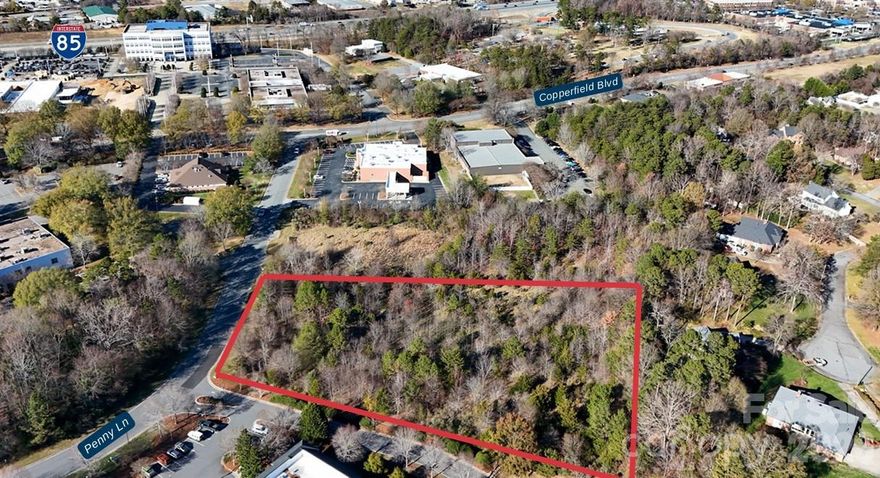 Situated on Penny Lane in Concord, NC, this C-2 zoned commercial land tract presents an attractive development opportunity in a growing commercial corridor. The property is in close proximity to medical offices, Atrium Health Cabarrus, Carolina Place Mall, and I-85, enhancing accessibility throughout the region.
The C-2 Commercial zoning permits a wide range of retail, office, medical, and service uses. The wooded site features rolling topography and is surrounded by a mix of commercial, medical, retail, and residential development.