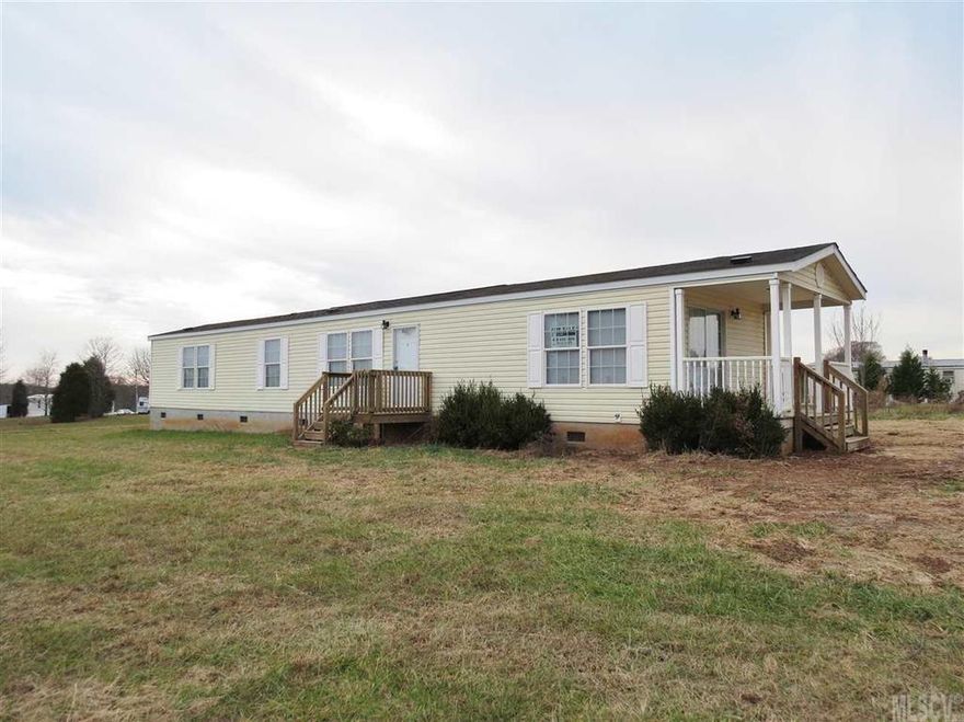 Move in ready, 2 Bedroom/2 Bath singlewide sold "as is, where is". Large living room and spacious kitchen. New flooring and fresh paint!  Suzanne Lane is a dirt road in need of repairs. Owner financing available