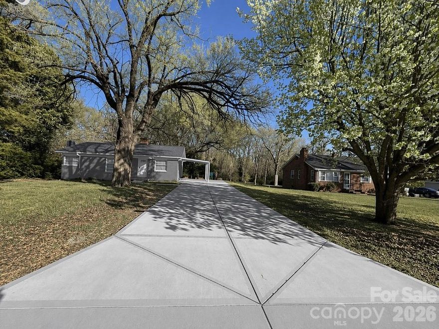 Welcome to this beautifully renovated 4-bedroom, 2-bathroom brick home offering approximately 1,506 sq ft of modern living space on a rare half-acre lot in a convenient Charlotte location.

Seller is highly motivated and offering $11250 'Buyer Choice' credit at closing with an acceptable offer that the buyer may use toward closing costs, home improvements, or to buy down the interest rate.

Originally built in 1954 with durable solid brick construction, this home has been thoughtfully updated with extensive renovations while preserving its strong structure and timeless character. The interior features fresh paint throughout, brand-new flooring and subflooring, and a completely remodeled kitchen with granite countertops, modern cabinetry, and all-new appliances. Spacious living areas provide comfort for loved ones and plenty of room for entertaining.

Major upgrades offer peace of mind for years to come, including a new HVAC system with new ductwork, new windows and doors, updated bathrooms, new gutters, and a new vapor barrier.

Step outside to enjoy the expansive half-acre yard, offering exceptional outdoor space rarely found so close to the city. The property also features a large driveway with abundant parking, a newly built connecting carport, and a shaded concrete patio perfect for relaxing or hosting gatherings.

The location is ideal for both convenience and lifestyle. The home is within walking distance of an elementary school and located next to beautiful large community parks, making it a fantastic setting for loved ones and outdoor recreation.

Just minutes from Uptown Charlotte and Charlotte Douglas International Airport, the home also provides quick access to Interstate 85 and U.S. Route 74, making commuting and city exploration easy.

This move-in-ready property combines modern upgrades, a rare large lot, excellent park access, and a prime location—a unique opportunity in the Charlotte market.

Key Features

• 4 Bedrooms / 2 Bathrooms
• Approximately 1,506 Sq Ft
• Rare 0.45 Acre Lot
• Solid Brick Construction
• Fully Renovated Interior
• Granite Countertops & New Kitchen Cabinets
• All New Appliances
• New HVAC System + New Ductwork
• New Windows & Doors
• New Flooring & Subflooring
• Fresh Interior Paint
• New Gutters & Vapor Barrier
• Large Driveway with Plenty of Parking
• Newly Built Connecting Carport
• Shaded Outdoor Concrete Patio
• Walking Distance to Elementary School
• Next to Large Community Parks
• Minutes to Uptown Charlotte and the Airport
• Easy Access to I-85 and US-74