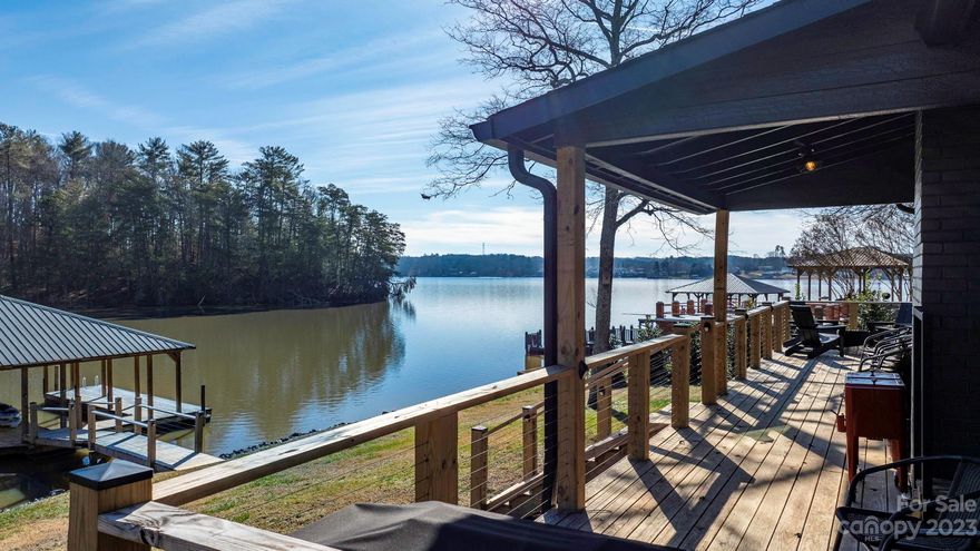 Back on market due to no concerns with the property. This Lake Hickory cabin is utterly charming.  Originally built in 1965, it was taken down to the studs and thoughtfully and thoroughly restored to it's current state.  Modern function and rustic charm make this cabin the perfect retreat.   Imagine enjoying a cup of coffee on the porch as you watch the sunrise from your adirondack chair.   You will enjoy modern amenities like dishwasher, disposal, washer/dryer, tankless water heater, high speed internet, and brand new HVAC with new duct work.  The lake front is right outside your front door with a beautiful covered dock.  Riprap on the shoreline was replenished and is in excellent shape. This wide open cove is the perfect spot for swimming, kayaking, fishing and paddle boarding and the Sandbar Restaurant and Marina are a short 5 minute boat ride away! This sweet cabin is a perfect vacation home, primary home or investment property.  Come and see for yourself!