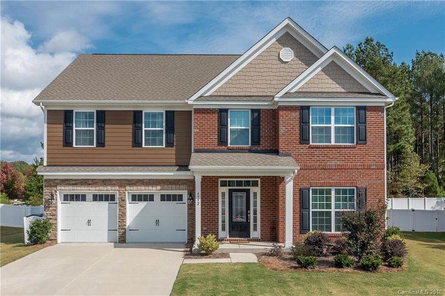 Lovely brick/stone/fiber cement home on one of the largest FLAT PREMIUM lots in the community! Hardwood flrs on 1st flr, 2" blinds thru-out, entire home repainted. Grt Rm w/Gas FPL, huge kit w/staggered cabs, under cab lighting, granite, subway bksplsh, pendent ltg, SS appl's, gas Stove. Deep tray ceiling in MBR w/sitting area, tiled baths, lg 4th BR/Bonus. Backs to trees, close access to Carolina Thread Trail & Walnut Creek Park w/Ballfields. Pool, Tennis, Fitness, Playgrounds, Walking Trails.