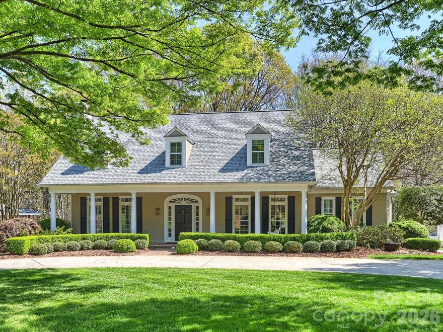 Set on a private .7-acre lot in the heart of Gleneagles in South Charlotte, this distinguished lowcountry-inspired home is elegant yet comfortable.  This house has a gracious flow perfect for day to day living and sophisticated entertaining. With a wide, welcoming front porch and interiors with abundant natural light and architectural detail, this home has it all. The main level has well-appointed living spaces—formal yet inviting. 10 ft ceilings on main and 9 ft ceilings upstairs, tailored millwork and airy spaces create a sense of quiet luxury throughout. A chef’s kitchen has gas cooktop, a large walk-in pantry, stainless appliances, and a butler's pantry with beverage fridge.  A serene primary suite upstairs is complete with spa-like bath and thoughtfully organized closet spaces. Secondary bedrooms provide flexibility for guests, family, or dedicated workspaces. Outdoors, a large deck is great for outdoor relaxation and entertaining and the deep lot offers both privacy and possibility. Welcome home to Carnoustie Lane!