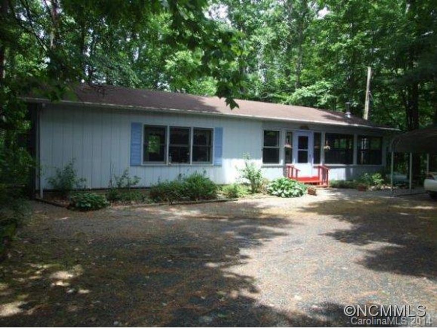 Once was a single wide, now is an enclosed, remodeled, expanded mountain home. Private lot in small subdivision of all stick builts. Eat in sunroom, large private deck. Most furnishings included. Both a propane monitor and a wood stove make this a comfortable home year around. Six miles to Burnsville, 40 minutes to Asheville.