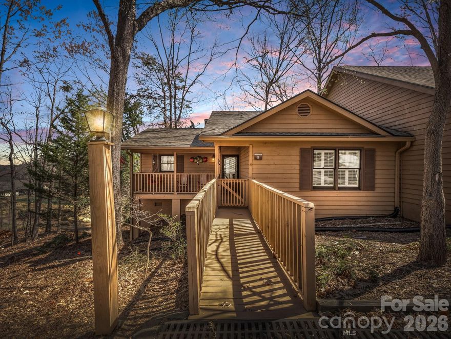 Stunning 2 bedroom/2 bathroom condo overlooking the golf course! 
This home offers an open concept with a wood burning fireplace in the living room with double sliding doors leading to the deck that overlooks the golf course. 
The primary bedroom has double closets with an ensuite. Down the hallway you will find a full bath with a second bedroom at the end of the hallway. 
Laundry is in the hallway in a closet.
Outside entry to the basement that has been updated for more room for fun! The current owners have 2 twin beds and a little eating area there. There is a full bathroom in the basement as well. Electric fireplace heats it up nicely in the winter...cozy! 
Enjoy all that Rumbling Bald and Lake Lure has to offer: indoor pool, outdoor pool, golf course, walking trails, fitness center, tennis courts, sauna, recreation room, playground plus more! 
Most furnishings convey, list of what does not convey is provided. Move in ready! Back deck is getting resurfaced, according to HOA exterior paint scheduled in September. 
Seller will pay the one time initiation fee for Rumbling Bald at closing. 
Don't miss out on this one!