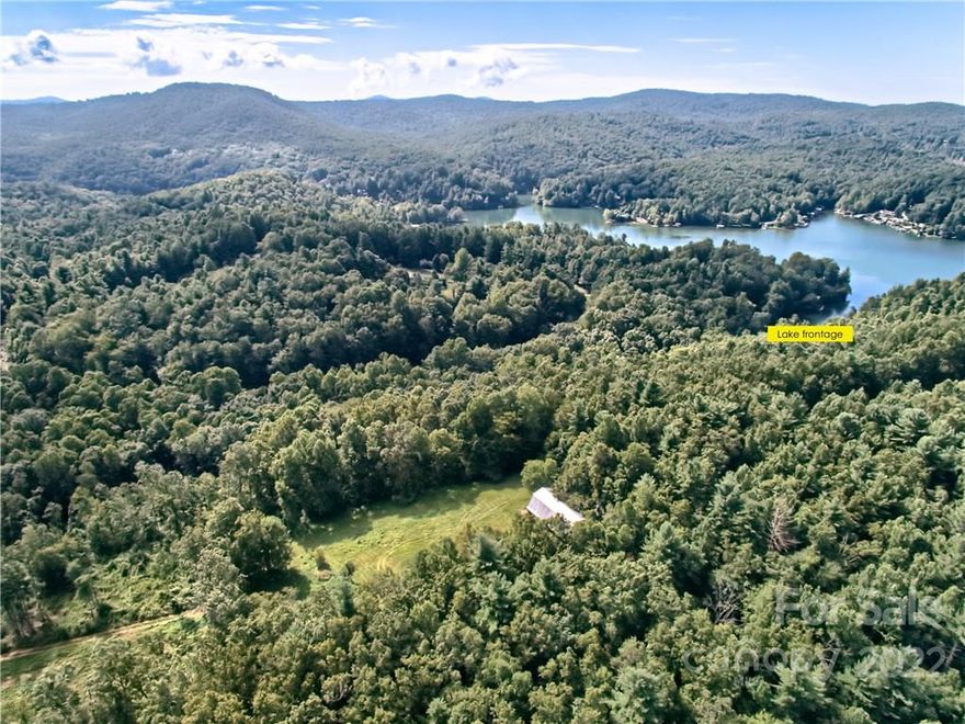 Lake Summit frontage, wonderful site for multigenerational compound, resort, or low density development.  Adjoins future Saulda Grade rails to trails. https://conservingcarolina.org/saluda-grade. A very rare and special find! Sea wall on part of 250+ft of lake frontage. Two boathouse sites. Camp Windy Wood, 67.5 acres with views, pastures, two basic houses, nice large barn, public water access, multiple state road frontages, internal private roads, subject to Lake Summit Shoreline Rules, WR and R2R county zoning, which means about a 40/60 blend of 3/4 acre and one acre lots. About 80 units possible, but lower density encouraged. Other special uses may be obtainable.  Includes 360 and 373 Camp Windy Wood Rd.