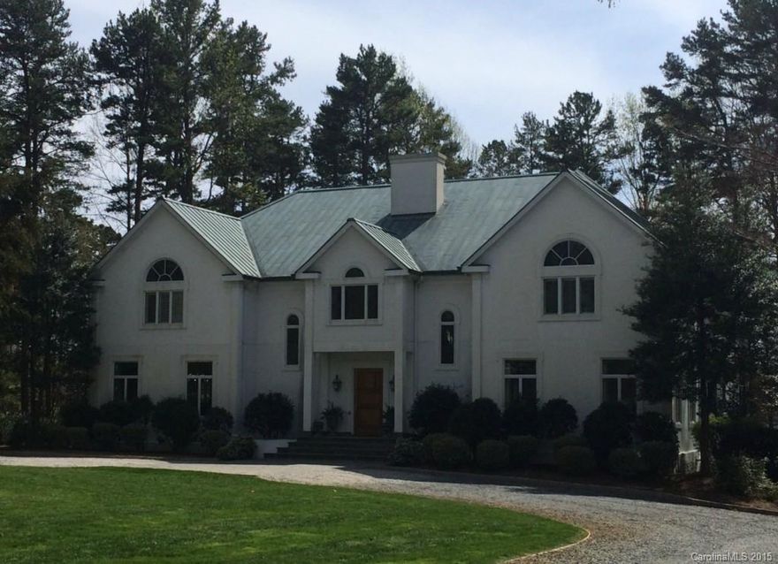 Private French Country Plantation on 162' waterfront. Heart of pine flooring, solid wood doors, 100% copper roof, 5 zone hot water heating system. 2 master suites-one on main level. GR has 30' ceiling and mexican tile floor. Thermadoor commercial stove, sub zero fridge and freezer. 1200 soft decks w/2 screed porched. Lake level has living area w/bedroom and exercise room. Pier & dock. 2 fireplaces.