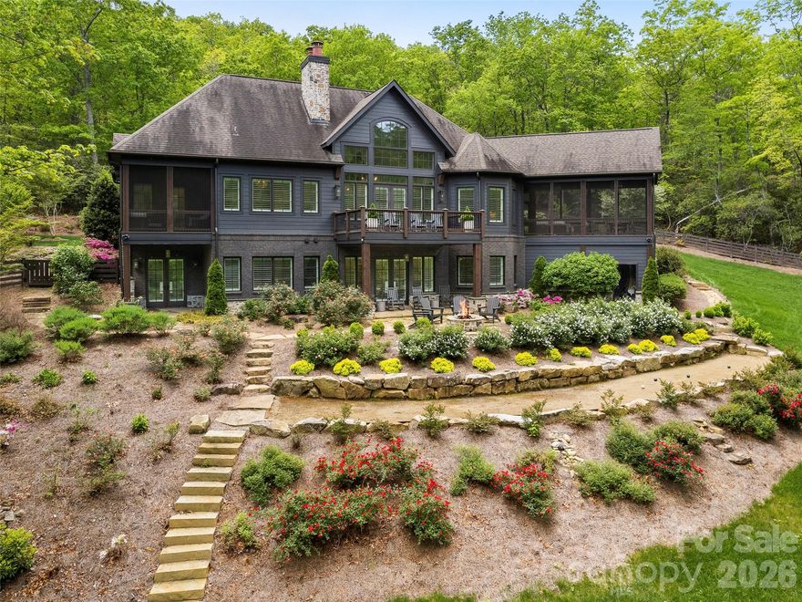 Exquisite  4 bedrooms and 4.5 baths home borders the Pisgagh National Forest and situated within the gates of Walnut Cove. Thoughtfully renovated, this luxury retreat offers seamless harmony between refined design and the natural beauty of this private estate with views. Gather in the enclosed porch with a stone fireplace just off the kitchen, where sweeping views provide the perfect backdrop for year-round enjoyment.

Interior highlights include soaring vaulted ceilings, three elegant fireplaces, a private elevator, and tastefully updated fixtures and appliances throughout. Three spacious en-suite bedrooms ensure comfort and privacy for family and guests, while the fenced yard creates an inviting outdoor sanctuary.

Close to the walking trails, state-of-the-art Wellness Center, and the acclaimed Jack Nicklaus Signature Golf Course, the convenience of proximity to all that this highly sought-after gated community has to offer makes this home truly special. A rare blend of mountain serenity and sophisticated living, this home embodies the best of Walnut Cove luxury.

Come home to The Cliffs at Walnut Cove, where one membership opens a world of activities and friendships in seven communities in NC and SC!