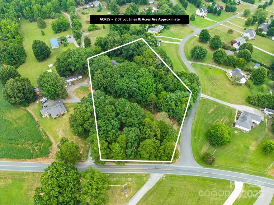 Towering massive oak trees sit on the back of the property that would make a beautiful building site and plenty of room for a large shop or barn or a outdoor living area. Property is beside Ashley Hall and in area of several newer custom homes. Close to Parkwood Middle & High School. Existing home was two residences joined together and built at separate times. There are two separate septic systems on property. There is NO value in the home and can not be viewed. All structures are AS-IS WHERE-IS There is a driveway easement on far left lot line and possible joint well easement because of Prescriptive Easement. Acreage may adjust with new survey. Survey will be at buyer's expense.