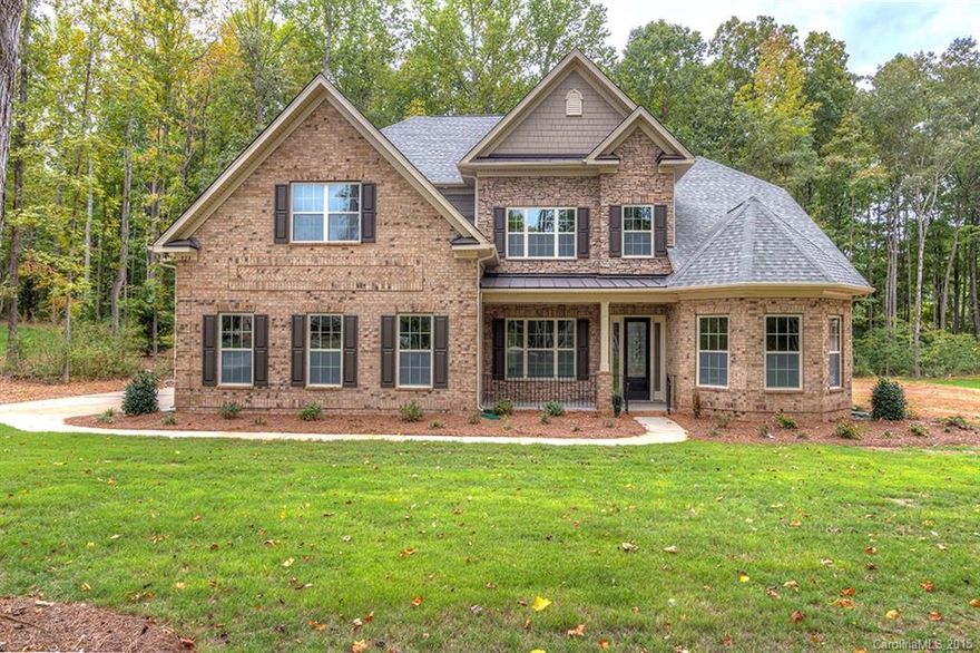True dual owner's suites in this open floorplan.42"Cherry Java cabinets,granite kitchen/baths,tumbled stone backsplash,cabinetry hood,wall-oven,SST app,butler's pantry w/wine rack,family rm w/stone fireplace &coffered ceiling.Arches/heavy molding thru-out, hardwoods on main.2nd owner's upstairs has sitting rm, oversize his&her walk-in closets.Bonus rm w/french drs. Energy efficient features inc.tankless water heater, radiant roof barrier.1+acre wooded lot less than 10 min to Buster Boyd Bridge.