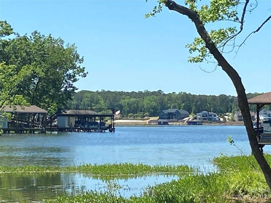 Enjoy all that Lake Tillery offers without the high expense of most waterfront lots. This 1.5+- acre water view wooded lot is in the desirable Swift Island Plantation gated community. A gently sloping contour allows for a variety of foundation plans and a homesite that takes advantage of the long range lake views.   Build your dream home in this established gated lakefront neighborhood just a few minutes from Tillery Tradition Country Club and golf. Launch your canoe, kayak, or paddle board just steps from your back door.  This lot is within Duke Energy's Resource Protection and Management area so no pier, boathouse, or alteration of the shoreline is permitted,( See Attachments )  This preserved area adds additional privacy to this lot and protection to nature and the shoreline. See the attached HOA addendum for annual and capital fees. Buyer must be accompanied with an agent to gain access and view this property.