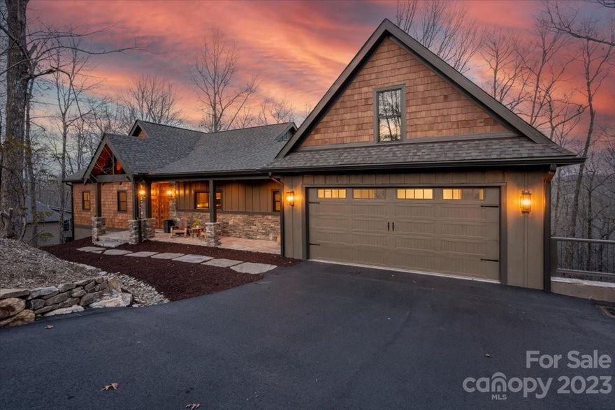 Here is your opportunity to own new distinctive construction with high-end custom finishes throughout! Enjoy this beautifully designed home with year round mountain views from practically every room. With easy access to the East Fork Gate, close to parks, clubhouse & trails, the location is ideal. Features include a cook's dream kitchen with quartz countertops and designer backsplash, generous sized elegant primary suite & bath. A large laundry room & separate half bath are just off the kitchen. The comfortable outdoor living space has upper and lower expansive decks & screen porch. The lower level includes an executive office, family room, 2 bedrooms, one of which is ensuite, additional full bath, & plenty of storage.  An extra large garage is perfect for all your equipment. Extensive beautiful hardscaping was installed along the in front & a professional landscape plan is available. All professionally designed and decorated, this home is a perfect blend of mountain elegance.