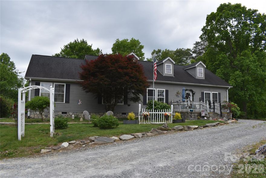 Country privacy surrounds on this 9.57+/- acres unrestricted land with beautiful surrounding mountain views.  This 3 bedroom, 2 bath off frame modular home sits on top of a large knoll that offers 360 degree views. The home features a split floor plan, an large open living room/dining room, kitchen with an island along with corian countertops, ceramic tile floors, double ovens along with a new dishwasher.  The guest bath has marble flooring, while your master bath has a jetted tub, shower & double vanity. In addition to the 1904+/- sf level, the attic level has the potential to be finished for additional room.  You have a nice porch overlooking a beautifully landscaped yard.  A gardeners dream with plenty of potential garden area and you also have a Japanese Lantern tree, Paw Paw trees, Chestnut trees, Black Walnut trees, Asian Pears, tame rasberries, purple muscadines along with flowers galore.  You are almost in the center of the property you have room to expand, make a family compound, a small farm or whatever your heart desires.  You are convenient to I-40 and just a short drive to Buncombe County for an easy commute.  You are close to the town of Old Fort, Black Mountain along with Marion.