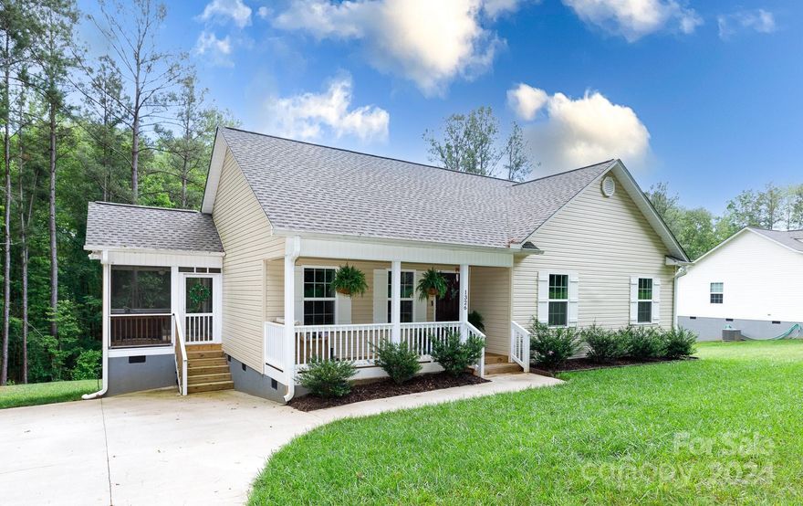 Welcome to your dream home! This stunning 2-year-old property boasts 3 spacious bedrooms and 2 baths, nestled on a picturesque 1-acre lot. Imagine relaxing on the cozy front porch or enjoying peaceful evenings on the screened porch. There is even a serene stream that runs through the property. Step inside to the inviting living room, featuring vaulted ceilings and beautifully patterned wood walls, creating a warm and stylish ambiance. The primary suite is a true retreat with its elegant tray ceiling, dual sinks, and dual closets, offering both luxury and convenience. The kitchen is equipped with granite countertops, a breakfast bar, and a generous pantry. Perfect for hosting family and friends, this home blends country living with easy access to all three assigned schools, a charter school and nearby amenities. Experience the best of both worlds in this exceptional home, where comfort meets convenience. Don't miss the chance to make this your forever home!