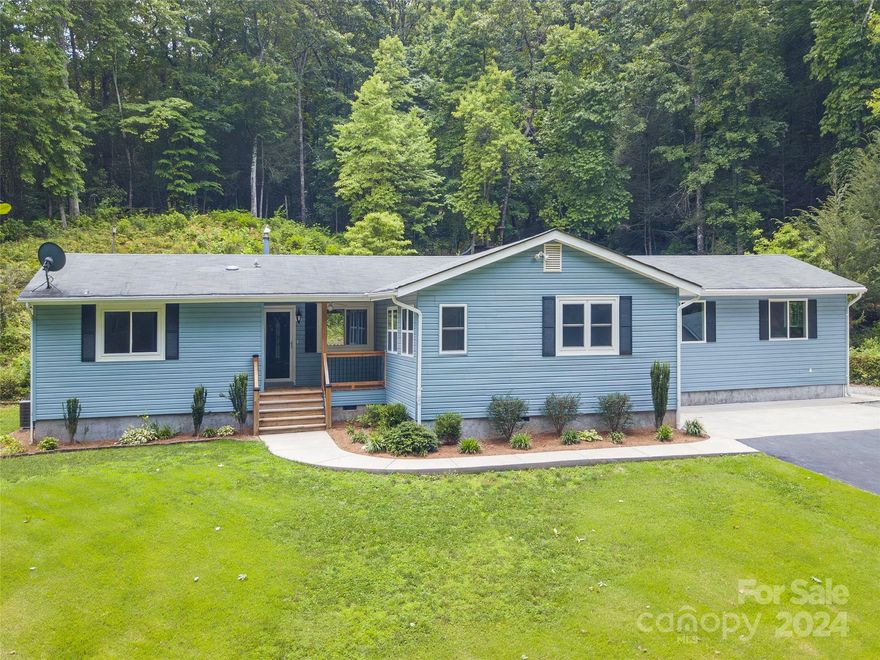 Welcome to the ultimate in privacy and single-level living with this pristine 4 bedroom, 3 bath
home in a park-like setting of 14.77 sub-dividable acres. Gleaming wood floors welcome you into the living room, adjacent to the bright and open eat-in kitchen with all stainless steel appliances, and tons of cabinet and counter space. The all freshly-painted interior features sparkling
updates to the kitchen and baths, windows, HVAC, flooring, and a totally encapsulated crawl space. Enjoy groomed and natural forests, year-round creek, open pastures, barn, garage workshop, extensive spaces for animals, gardening, and family gatherings. Relaxing private rear deck with composite floors and railings.  
Feel like you're living a world apart, yet only MINUTES TO LAKE JAMES, the quaint township of Marion, and all the conveniences of groceries, retail shops, eateries, schools, healthcare, and more.  Less than 2 miles from I-40, and only a half hour or so from Asheville's vibrant downtown.