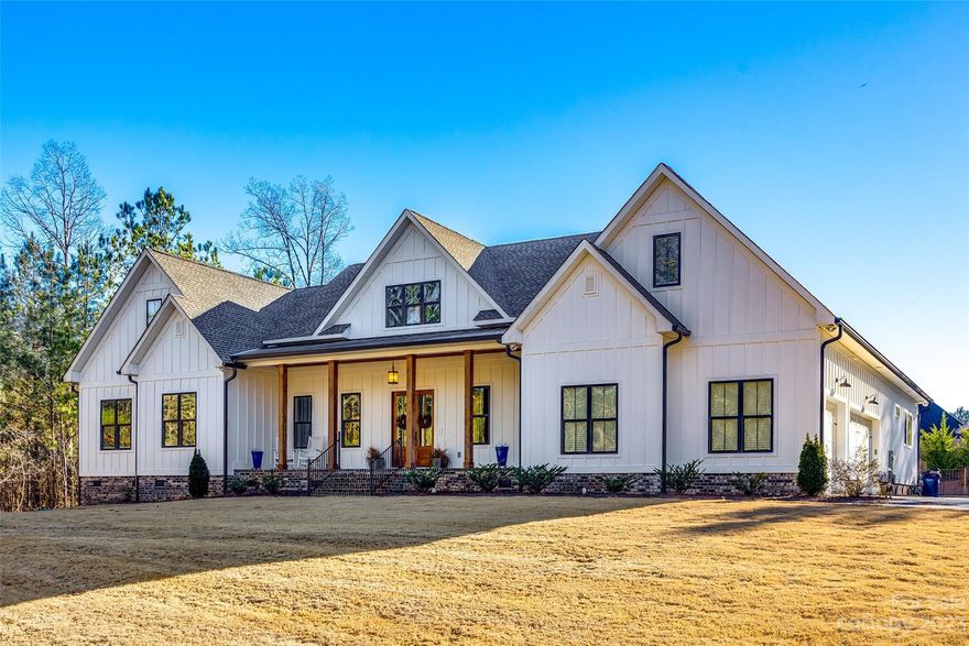 Welcome to this STUNNING 4-bedroom, 4-full bathroom home that seamlessly combines modern luxury with classic farmhouse charm. The main floor features a primary bedroom for your convenience, ensuring comfort and accessibility. The open living room and kitchen area provide a perfect space for entertaining and family gatherings. The kitchen boasts a huge walk-in pantry, offering ample storage for all your culinary needs. Each bedroom comes with its own ensuite bathroom, providing privacy and convenience for everyone. Situated on an expansive one-acre lot, this property offers both space and serenity. Enjoy the outdoors with a 3-car garage and a heated pool and hot tub. As you step into the backyard, you'll be greeted by a refreshing pool and a relaxing hot tub – perfect for unwinding after a long day or hosting summer gatherings. Catawba Shores Estates has over 150 acres of greenspace and trails along the Catawba River for all to enjoy.