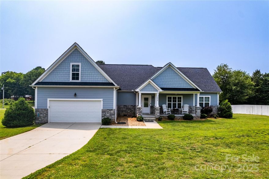 Spacious and thoughtfully designed home offering three bedrooms and two and a half bathrooms, providing plenty of comfortable living space for family and guests. The open floorplan features a large living area perfect for entertaining, a breakfast area, and a kitchen equipped with granite countertops, a generous island with seating, and ample cabinetry for storage. Beautiful engineered hardwood flooring flows seamlessly throughout the entire first floor, enhancing the warm and inviting atmosphere. The large primary bedroom includes a sizable bath with dual vanities, a tiled shower, a huge walk-in closet, and direct access to the laundry room. Upstairs, a spacious bonus room provides flexible space ideal for a home office, playroom, media room, or guest retreat—offering extra room without compromising the main living areas. Enjoy peaceful country living with pastoral views of cows across the street, just minutes from shopping, dining, and everyday amenities along Hwy 73.