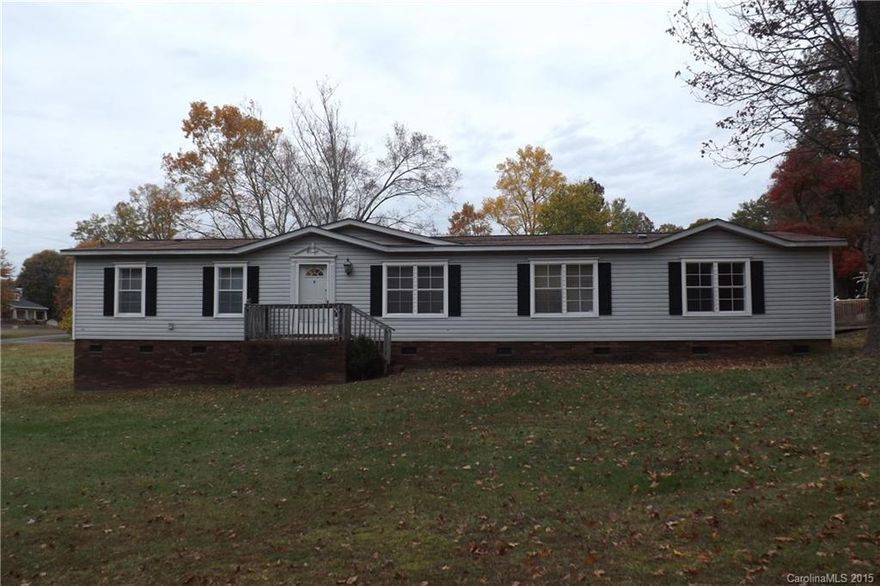 This Is a Beautiful Double Wide, Big open kitchen with open pass through.Crown Moulding, Master bedroom has A retreat in it and has his and her closets. It sits on a corner lot.Office,Porch on back with handicap access, Dog lot, Come and sit by the fireplace this winter. Has a out building, Carson school district.