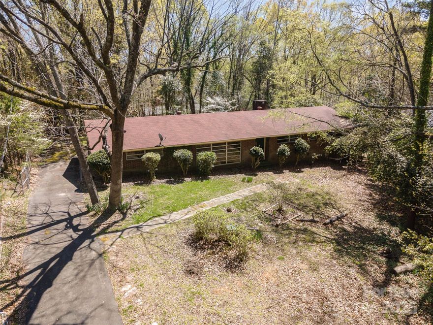 Great location with tons of potential! This well-built, full-brick home sits on a fantastic oversized lot on a quiet road, making it a perfect canvas for its next owner. Whether you're looking to renovate, expand, or enjoy it as is, the solid construction and timeless character provide a great foundation. The large lot offers ample space for outdoor living, gardening, or future additions. Located in a highly desirable area, you'll enjoy easy access to top-rated schools, shopping, dining, and major highways—all while tucked away in a peaceful setting. Don’t miss this rare opportunity to own a home with incredible potential in a sought-after Charlotte location!