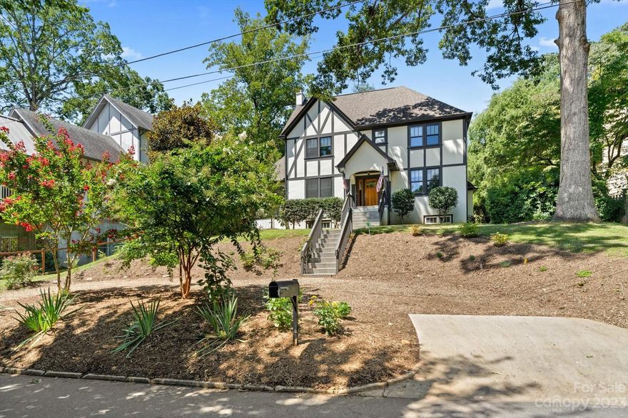 Welcome to a timeless treasure nestled in the heart of Kenilworth. This stunning Tudor home, with its iconic 1926 architecture, has been meticulously updated to offer the perfect blend of classic charm and modern luxury. Ample space for all your needs with 4 bedrooms (2 primary suites), 4.5 bathrooms, a fully equipped theater room, as well as a bonus room in the fully finished Basement. This home boasts fresh paint throughout, an open concept gourmet kitchen with Carrera marble countertops, double oven, gas range, and a large kitchen island that will fit the whole family. In every bedroom you'll find impeccably designed custom closets ensuring your belongings are well-organized. The large covered porch and the back patio will be the perfect spot to enjoy fall in your new home. Enjoy the convenience of being close to renowned hospitals, downtown Asheville's vibrant scene, and parks and walking trails nearby. Don't miss the opportunity to make this truly move-in ready residence your own.