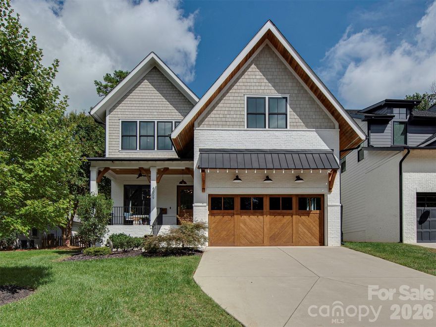 Modern Farmhouse in Cotswold Charlotte NC | Built 2020 | Luxury Kitchen + Covered Porch with Fireplace
Farmhouse Charm Meets Modern Luxury in Cotswold, Charlotte NC!
Welcome to your storybook modern farmhouse tucked on one of Cotswold’s quietest streets — where timeless design meets everyday comfort in one of Charlotte’s most sought-after neighborhoods.
Built in 2020 by Bungalow Designs, this 4-bedroom home blends high-end finishes, thoughtful craftsmanship, and effortless indoor-outdoor living.  
Step inside to a warm, inviting foyer wrapped in classic paneling. A private study with custom ship-lap detail creates the perfect work-from-home office or cozy retreat.
The heart of the home? A chef’s kitchen designed for entertaining.
*Massive walnut island with seating
*JennAir 48-inch professional gas range
*60-inch Electrolux refrigerator
*Custom cabinetry and designer finishes
The open-concept living room features cedar-shelved built-ins, a statement fireplace, and wide sliding doors that open seamlessly to a covered porch with its own gas fireplace — ideal for year-round entertaining in Charlotte’s mild seasons.
Upstairs, the luxury primary suite feels like a boutique hotel escape, complete with:
*Reclaimed wood fireplace
*Dual walk-in closets
*Spa-inspired primary bath with high-end fixtures and designer hardware
A private guest suite offers visitors their own retreat, while two additional bedrooms share a Jack-and-Jill bath. The open loft with built-in snack bar is perfect for movie nights, play space, or a second living area.
Located in Cotswold Charlotte, minutes from SouthPark, Uptown, top-rated schools, dining, and shopping, this home offers the charm of a quiet residential street with unbeatable convenience.
This isn’t just a house — it’s a modern farmhouse built for gathering, celebrating, and living beautifully.  Showings start Friday!