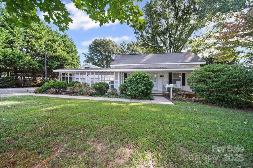 Vinyl Sided Ranch Style Home-conveniently located in the Town of Clover-2 Bedrooms & 1 Full Bath/Walk In Shower with Glass Shower Surround/Door-Small Foyer Entry to Formal Living Room-Split Bedroom Plan-Primary Bedroom features Double Closets-Kitchen features updated cabinetry-laminate counters-tile backsplash-White appliances include smooth top electric range/oven, dishwasher, side by side refrigerator, microwave, & disposal-mudroom entry via side door includes washer & dryer connections/storage cabinetry. Den is located at rear of home features gas log fireplace. Additional fireplaces in home are not functional. Exterior features include covered front porch, rear patio, attached carport entry off front porch-detached oversized 2 car garage(978SQFT) with door openers that is heated-finished recreation room or hobby room over garage with half bath-also features eave storage-Additional Workshop Storage Area on back of detached garage with roll up door-Not heated-can be equipment storage or additional workshop space-covered concrete pad for equipment parking or additional patio area-0.62 Acre Lot that features mature trees & plantings(no recent survey-dimensions given are from Survey for WP Smith lot dated May 5, 1926)-Clover School District #2 attendance area-quietly but conveniently located to schools, churches, retail,  & restaurants. Property is part of an estate so personal representative is exempt from completion of residential property condition statement. Court house records say age of home is unknown-age given is an estimate.