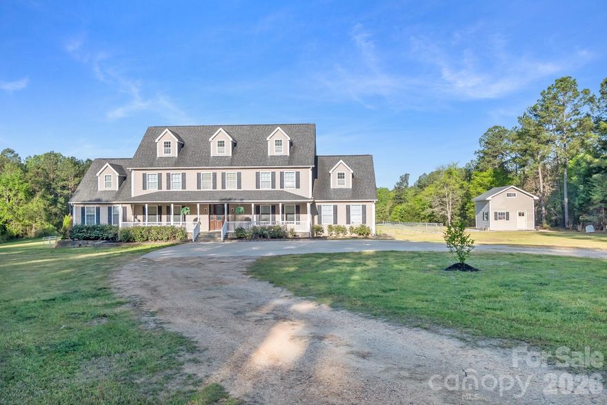 Incredible opportunity to own approximately 45 acres featuring a spacious 5,400+ sq ft home with endless possibilities for hobby farming, equestrian use, recreational enjoyment, or multi-generational living. The property offers a beautiful mix of cleared pasture, mature hardwoods, pines, walking trails, and a scenic creek along the back portion of the land. Inside, you’ll find hardwood flooring throughout most of the main and upper levels, spacious living areas, and a large kitchen designed for entertaining with an oversized island, gas cooktop, ample cabinetry, and generous dining space. The home features two primary bedrooms on the main level, offering flexibility for multi-generational living or guest accommodations. Upstairs you will find three additional bedrooms, an office, loft area, and another full bathroom. The third floor offers a large bonus room perfect for a media room, playroom, gym, or additional flex space.  The property includes three outbuildings, one featuring a lean-to—ideal for equipment storage or future agricultural use. Enjoy peaceful country living with room to roam while still being conveniently located to nearby shopping, dining, and major roadways. Motivated seller brings added opportunity to make this exceptional property your own. Whether you’re searching for privacy, acreage, or a property with room to create your vision, this one is a must see!