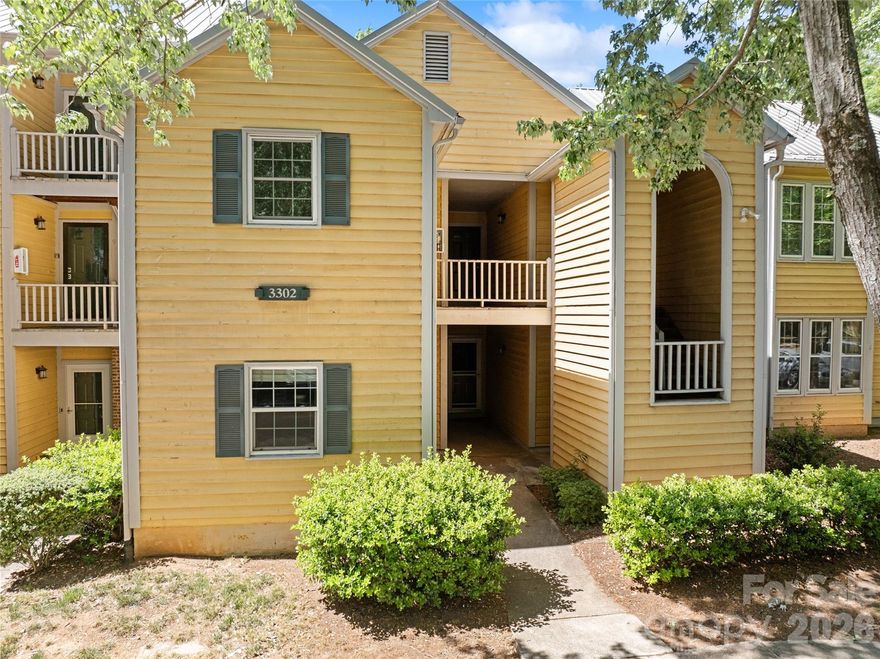 Charming Updated 1-Bed, 1-Bath Condo in Sedgefield’s Selwyn Farms / Hunters Run. This beautifully refreshed second-floor condo offers the perfect blend of modern finishes and relaxed living. Featuring wood laminate flooring throughout, designer accent walls in the entry and primary bedroom, and a stylish glass-enclosed shower with subway tile, every detail has been thoughtfully upgraded. The open-concept kitchen boasts newer cabinets, stainless steel appliances, and granite counters, flowing seamlessly into the dining area and spacious vaulted living room. A wood-burning fireplace anchors the living space, while a large sliding glass door opens to an oversized private terrace overlooking serene nature — the ideal spot for morning coffee or evening unwinding. Enjoy resort-style amenities with the community pool and outstanding walkability to South End, Dilworth, and Myers Park. Whether you’re looking for restaurants, shopping, parks, or entertainment, everything is just minutes away. Move-in ready home in one of Charlotte’s most desirable central locations.