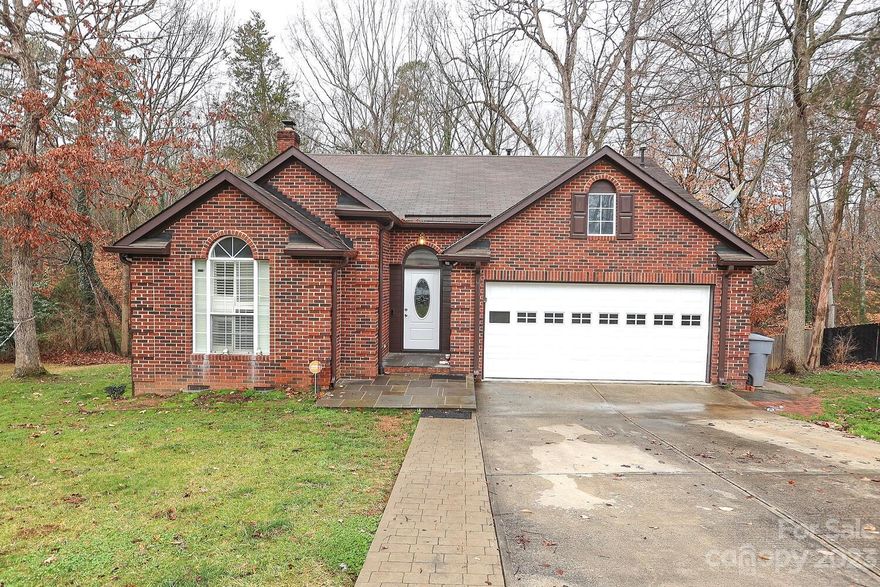 DISTINCTIVE RANCH HOME WITH VAULTED CEILINGS, BREAKFAST AREA. VERY WELL MAINTAINED WITH 2 CAR GARAGE. FENCED YARD. LIVING ROOM WITH HARDWOODS & WOOD BURNING FIREPLACE-NEVER USED-SOLD AS IS. GREAT KITCHEN WITH A NICE GRANITE, OAK CABINETS & TILED BACKSPLASH. FORMAL DINING ROOM. SPACIOUS OWNERS SUITE WITH TREY CEILING AND ENTRY TO DECK. OWNERS BATH WITH GARDEN TUB, SEPARATE SHOWER & WALK IN CLOSET. HUGE DECK SPANS ACROSS REAR OF HOME REDONE IN 2023. VERY PRIVATE WOODED BACKYARD! THE BATHROOMS WERE REMODELED IN 2023, GARAGE DOOR REPLACED IN 2021, rRRO REPLACED AROUND 2016, HVAC  REPLACED AROUND 2017/2018. THE FRIDGE, WASHER AND DRYER WILL REMAIN WITH AN ACCEPTABLE OFFER... NO HOA!!!