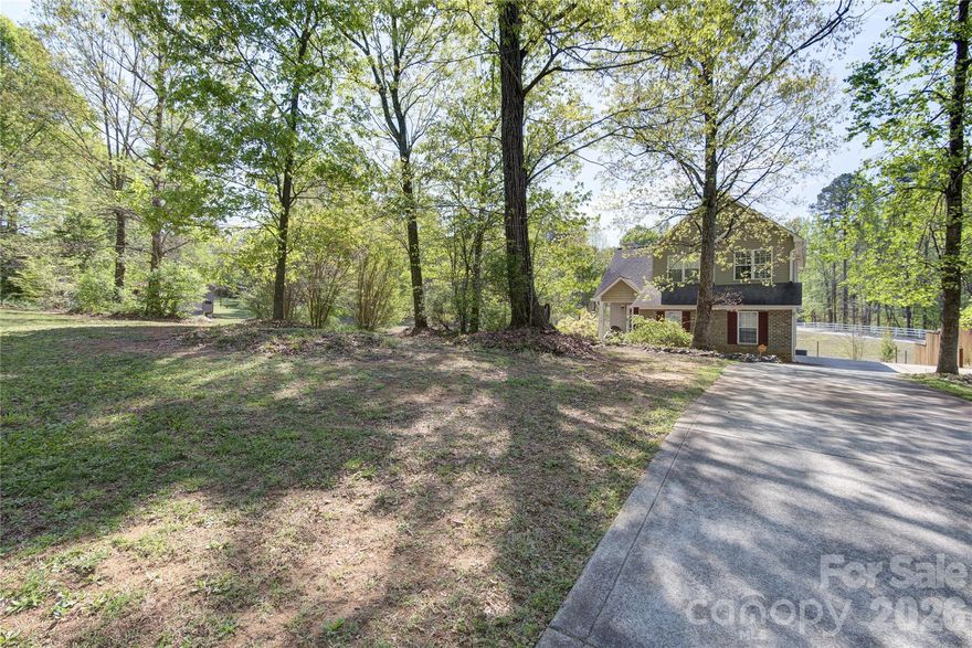 Price Reduction – Now $365,000!   Repositioned to reflect current market conditions and create strong value for buyers. This property offers a rare combination of a spacious ~0.70-acre lot, no HOA, and a functional 3BR/2.5BA layout with a 2-car garage. Conveniently located near Lake Norman State Park with easy access to Mooresville amenities. Move-in ready and competitively priced.   Imagine creating an outdoor space where you can spend long summer evenings or enjoy crisp, cool nights gathered around your fire pit! (Fire pit and seating area virtually staged.) This home on one of the biggest lots with NO HOA. allows you to do just that—don’t miss this opportunity. Bring your offers! This well-maintained 2-story home in Troutman sits on .70 acres —offering space, privacy, and value.   Located minutes from major employers like Lowe’s HQ, Lake Norman Regional, and Mooresville’s growing corporate corridor and Statesville/Iredell School Board.  Ideal for buyers working in Mooresville, Davidson, and Statesville area. Schedule your showing today and bring your offer!

Inside, you’ll find:

Bright, open living room with vaulted ceilings
Updated kitchen with granite countertops, ample cabinetry, and deep pantry
Dining area with chair rail detail
Primary suite with vaulted ceiling, walk-in closet, and updated flooring
Fresh neutral paint throughout

Enjoy the outdoors on the covered back deck, perfect for relaxing or entertaining. A 14x24 storage building provides plenty of extra space.

Additional highlights:

Furnace replaced in 2025 + HVAC maintained twice yearly
Septic recently serviced with transferable warranty AND NEW ALARM
Newer appliances (refrigerator in garage conveys, the one in the kitchen does not convey) + washer/dryer included

Conveniently located near major roads, shopping, dining, and just minutes to Lake Norman.

Strong value. Move-in ready. Schedule your showing today before it’s gone.