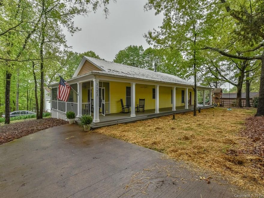 Remarkable find in historic Tega Cay! Custom built ranch in craftsman style w/covered, warp around porch & part screened porch & a tin roof. Lots of architectural detail: coffered ceiling, nice trim & moldings. KIT features beautiful cabinets, SS appl, & Travertine tile floor & backsplash. Awesome MBA: dual shower heads & slate tile. Lg laundry rm w/sink & a desk + shelves to serve as planning center/office.