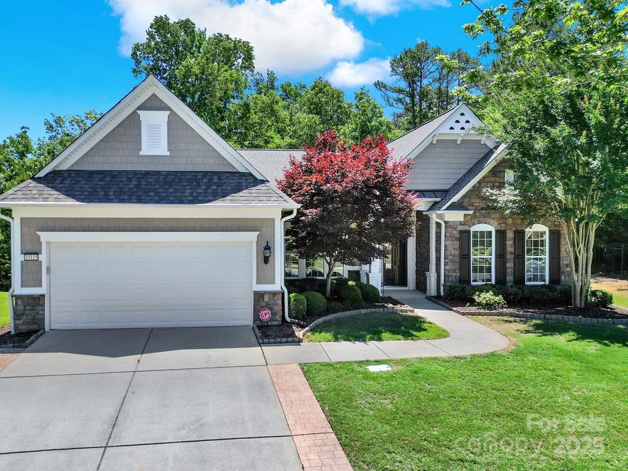 If you are looking for a private wooded homesite w/seasonal water & golf views, look no further. This beautifully updated Chestnut Garden home in 55+ Sun City Carolina Lakes has it all! Wood floors welcome you throughout the main living areas. Enjoy cooking in the chef's kitchen showcasing painted cabinetry, granite countertops, tile backsplash, stainless steel appliances, roll-out drawers & gas range. A breakfast bar w/seating opens to the spacious living room w/gas log fireplace flowing seamlessly into the bright, inviting sunroom. Double doors open to a home office or study & two generous secondary bedrooms share access to a full hall bath. The expansive primary suite w/tray ceiling offers a unique desk or bar w/cabinetry. Luxurious ensuite bath w/dual vanity, soaking tub, glass enclosed shower, & customized walk-in closet. Enjoy the tranquil backyard from the 3-season room or on the custom paver patio - ideal for grilling & entertaining. Resort style amenities make this a must see!