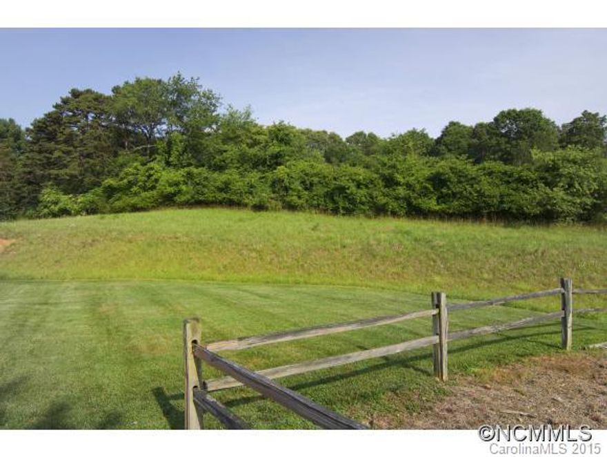 20 acre development site minutes from downtown. Graded pad ready sites in high-growth corridor.  Excellent interstate access and superb visibility. Located directly off Exit 23 (full interchange) on Interstate 26 in Woodfin. Less than 5 miles from downtown Asheville. +/-20.195 acres: Two graded pad sites (Lot A: +/-5.026 acres; Lot B: +/-3.582 acres) and Lot C: +/-11.587 acres of rolling pasture.