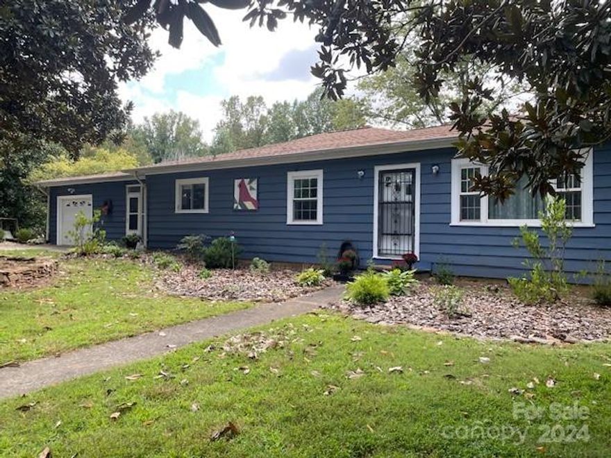 Country living in the city limits! This cozy 2br/1bath home has 1240 sq ft and sits on 7.3 acres. Half of which are beautifully landscaped fields with mature trees as well as an orchard. The house has hard wood floors, a wood burning fireplace, and a recently remodeled bathroom. The roof was replaced in 2019. It's close to many restaurants and main highways. Come see for yourself!