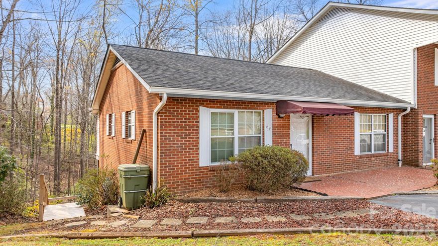 Enjoy comfortable one-level living in this charming 2-bedroom, 1.5-bath townhouse located just minutes from downtown Marion, yet outside the city limits for no city taxes. Situated in a quiet community, this end unit offers added privacy and convenient paved parking nearby.

Inside, the home features new laminate flooring throughout and a bright living room with skylights that bring in natural light. The kitchen comes fully equipped with refrigerator, range, and dishwasher, making it truly move-in ready. A heat pump with a backup propane wall heater provides year-round comfort.

Relax in the enclosed porch, perfect for enjoying morning coffee or quiet evenings. Additional space is available in the unfinished basement, ideal for storage or a workshop area.

The HOA handles exterior maintenance, giving you more time to enjoy the neighborhood amenities, including a community swimming pool. Utilities include a shared well and city sewer.

With brick siding, low-maintenance living, and a convenient location near shopping, dining, and downtown Marion, this townhouse offers the perfect blend of comfort, value, and convenience.